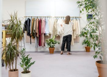 Photo by Ksenia Chernaya: https://www.pexels.com/photo/woman-fixing-clothes-on-the-rack-3965548/