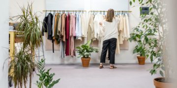 Photo by Ksenia Chernaya: https://www.pexels.com/photo/woman-fixing-clothes-on-the-rack-3965548/