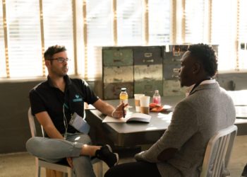Photo by nappy: https://www.pexels.com/photo/man-wearing-black-polo-shirt-and-gray-pants-sitting-on-white-chair-935977/