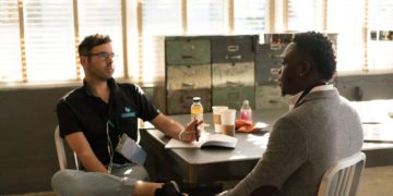 Photo by nappy: https://www.pexels.com/photo/man-wearing-black-polo-shirt-and-gray-pants-sitting-on-white-chair-935977/