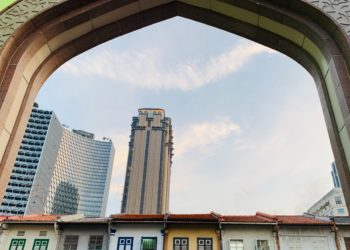 Photo by Shamsuddin Habib: https://www.pexels.com/photo/parkview-square-skyscraper-seen-through-gate-against-blue-sky-in-singapore-18249195/