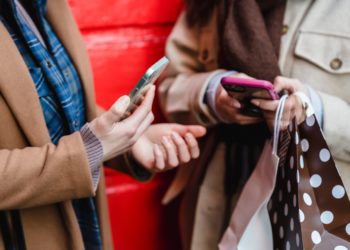 Photo by Tim Douglas : https://www.pexels.com/photo/unrecognizable-women-messaging-on-smartphones-after-shopping-in-city-6567382/