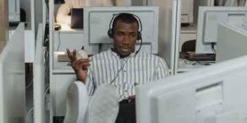 Photo by Tima Miroshnichenko from Pexels: https://www.pexels.com/photo/man-wearing-headphones-while-working-in-call-center-office-5453848/