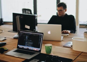 Photo by Djordje Petrovic: https://www.pexels.com/photo/man-in-black-shirt-sits-behind-desk-with-computers-2102416/