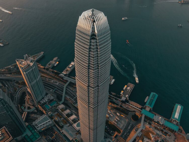 Photo by Tim Durgan: https://www.pexels.com/photo/geometric-skyscraper-located-in-city-downtown-at-seafront-4986555/