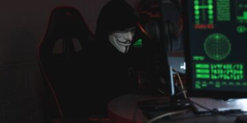 Photo by Tima Miroshnichenko: https://www.pexels.com/photo/person-wearing-a-mask-sitting-on-chair-while-using-a-computer-5380605/