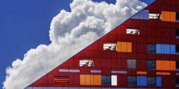 Photo by Ivan Cujic: https://www.pexels.com/photo/cloud-in-sky-and-building-109479/