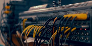 Photo by Jah Nomad: https://www.pexels.com/photo/a-close-up-of-a-computer-with-wires-and-cables-17220238/