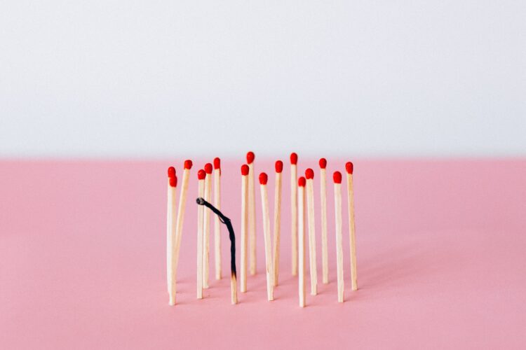 Photo by Nataliya Vaitkevich: https://www.pexels.com/photo/matchsticks-on-pink-surface-6837623/