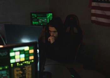 Photo by Tima Miroshnichenko: https://www.pexels.com/photo/man-in-black-hoodie-sitting-on-chair-looking-at-computer-monitor-5380585/