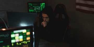 Photo by Tima Miroshnichenko: https://www.pexels.com/photo/man-in-black-hoodie-sitting-on-chair-looking-at-computer-monitor-5380585/