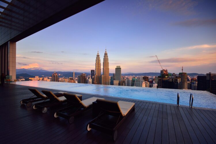Photo by Azri Suratmin: https://www.pexels.com/photo/brown-lounge-chair-on-side-of-swimming-pool-122244/
