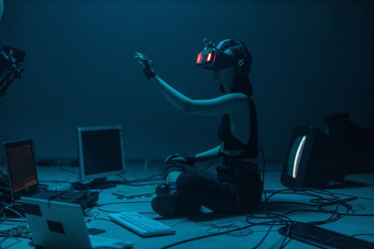 Photo by cottonbro studio: https://www.pexels.com/photo/a-woman-in-a-tank-top-using-a-vr-headset-8721318/