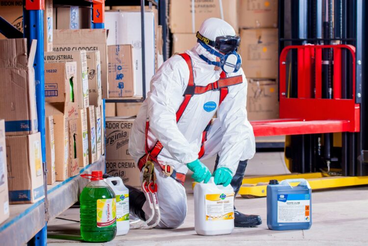 Photo by Pixabay: https://www.pexels.com/photo/person-wearing-white-suit-holding-white-container-209230/