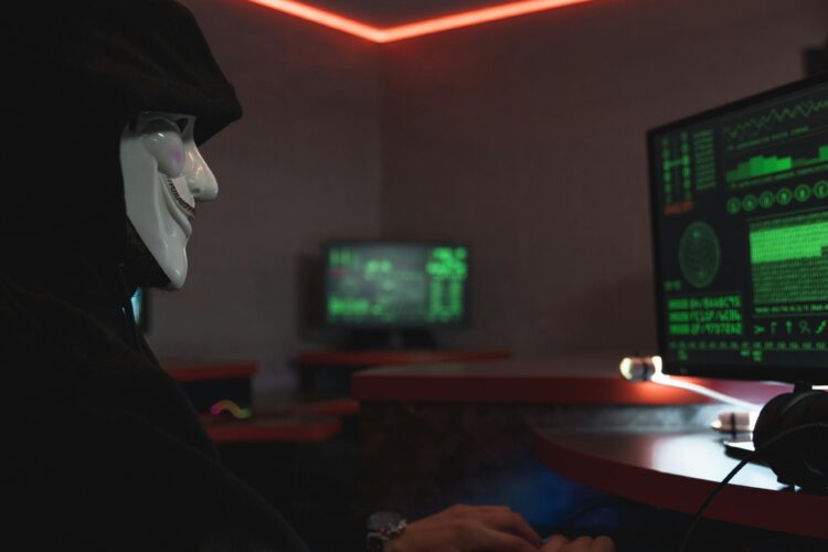 Photo by Tima Miroshnichenko: https://www.pexels.com/photo/a-person-with-mask-using-a-computer-5380608/