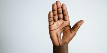 Photo by cottonbro studio: https://www.pexels.com/photo/person-with-silver-ring-with-white-cigarette-stick-4631062/