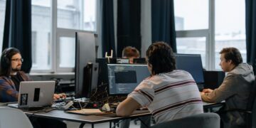 Photo by cottonbro studio: https://www.pexels.com/photo/men-sitting-at-the-desks-in-an-office-and-using-computers-6804068/