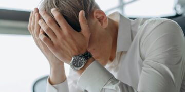 Photo by Mikhail Nilov: https://www.pexels.com/photo/a-man-places-his-hands-on-his-head-8297227/