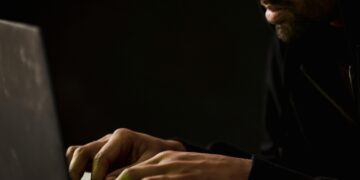Photo by Sora Shimazaki: https://www.pexels.com/photo/crop-bearded-man-working-on-laptop-in-darkness-5926362/