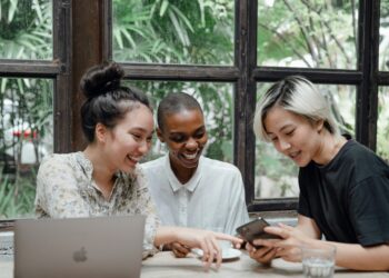 Photo by Ketut Subiyanto: https://www.pexels.com/photo/happy-multiethnic-women-having-fun-while-using-gadgets-in-cafeteria-4350210/