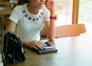 Photo by Porapak Apichodilok: https://www.pexels.com/photo/woman-wearing-white-romance-printed-crew-neck-t-shirt-while-sitting-on-brown-wooden-chair-346741/