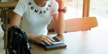 Photo by Porapak Apichodilok: https://www.pexels.com/photo/woman-wearing-white-romance-printed-crew-neck-t-shirt-while-sitting-on-brown-wooden-chair-346741/