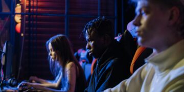 Photo by Alena Darmel: https://www.pexels.com/photo/gamers-playing-together-7862504/