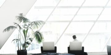 Photo by . .: https://www.pexels.com/photo/man-in-white-dress-shirt-sitting-on-black-and-white-tube-chair-931887/