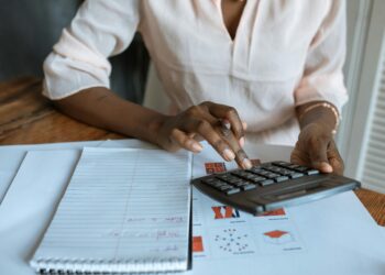 Photo by RDNE Stock project: https://www.pexels.com/photo/person-in-white-dress-shirt-using-a-calculator-5915230/