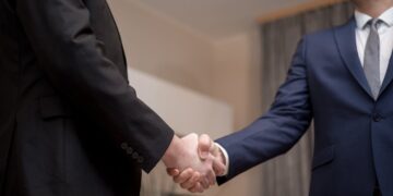Photo by George Morina: https://www.pexels.com/photo/men-in-black-and-blue-suit-jacket-doing-handshake-6918507/