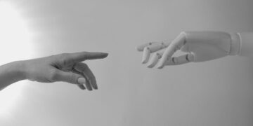 Photo by Tara Winstead: https://www.pexels.com/photo/black-and-white-photo-of-human-hand-and-robot-hand-8386422/