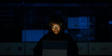Photo by Christina Morillo: https://www.pexels.com/photo/woman-wearing-black-hoodie-jacket-holding-grey-laptop-computer-1181325/ IT