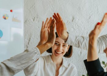 Photo by olia danilevich: https://www.pexels.com/photo/group-of-people-doing-high-five-8145330/