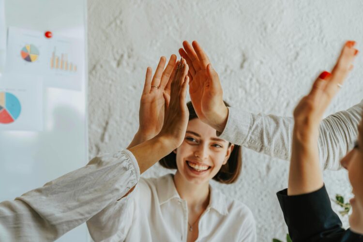 Photo by olia danilevich: https://www.pexels.com/photo/group-of-people-doing-high-five-8145330/