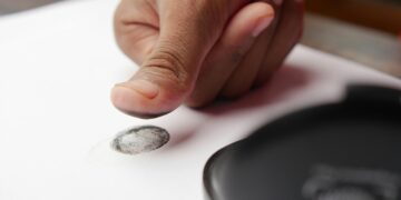 Photo by Towfiqu barbhuiya: https://www.pexels.com/photo/a-person-putting-a-fingerprint-on-a-white-paper-12375509/