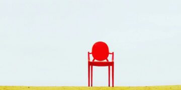 Photo by Waldemar Nowak: https://www.pexels.com/photo/red-armchair-on-brown-surface-910625/