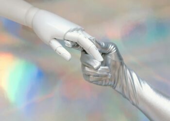 Photo by Tara Winstead: https://www.pexels.com/photo/hand-with-silver-glove-holding-a-robot-hand-8849283/