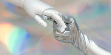 Photo by Tara Winstead: https://www.pexels.com/photo/hand-with-silver-glove-holding-a-robot-hand-8849283/